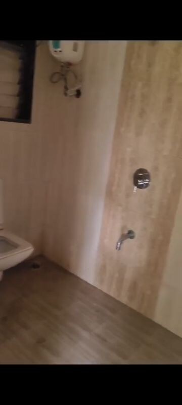 Bathroom in 1.5 BHK Apartment at Shree Sai D N Nagar Shivneri CHS Ltd, Andheri West – for Sale