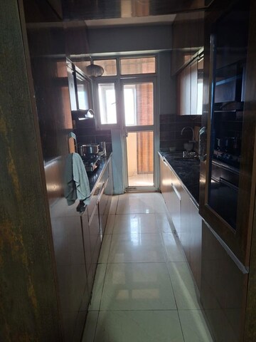 Kitchen in 3 BHK Apartment at Panchsheel Wellington, Dundahera – for Sale