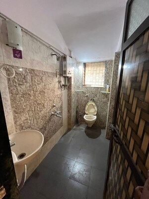 Bathroom in 2 BHK Apartment at Anand Sagar Residency CHS, Khopat – for Rent