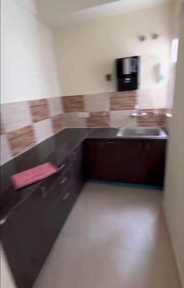 Kitchen in 2 BHK Apartment at Amrapali Dream Valley – for Sale