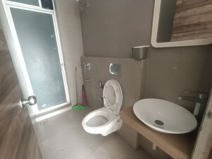 Bathroom in 2 BHK Apartment at Akshar Alvario, Seawoods – for Rent