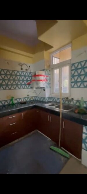Kitchen in 2 BHK Apartment at Amrapali Princely Estate, Sector 76 – for Rent