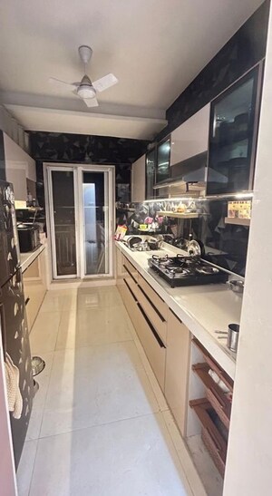 Kitchen in 2 BHK Apartment at Shree Tirupati STG Signature Residency, Thane West – for Rent