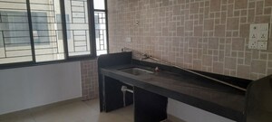 Kitchen in 2 BHK Apartment at Sargam CHS Nanded, Sinhagad Road – for Sale
