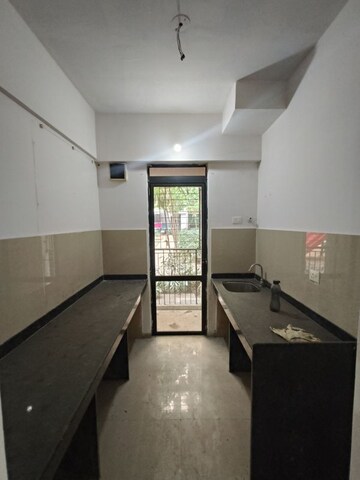 Kitchen in 1 BHK Apartment at Lodha Lakeshore Greens, Dombivli East – for Sale