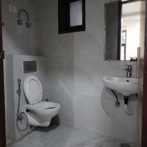 Bathroom in 1 BHK Apartment at Palm Residency Chhatarpur, Rajpur Khurd Extension – for Rent