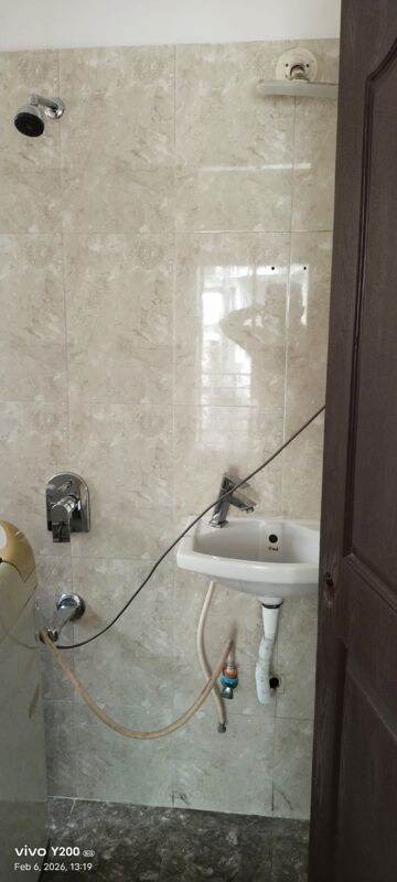 Bathroom in 1 BHK Apartment at Puranik City, Kasarvadavali – for Rent