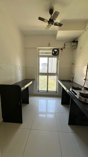Kitchen in 1 BHK Apartment at Raunak Unnathi Greens, Kasarvadavali – for Rent