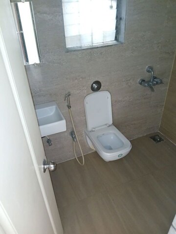Bathroom in 1 BHK Apartment at Raunak Heights, Ghodbunder Road – for Rent