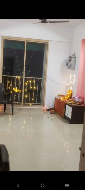 Living Room in 1 BHK Apartment at Applewood Satyesh Residency, Shela – for Rent