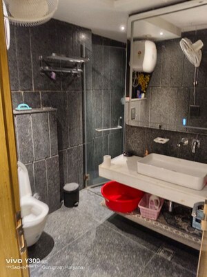 Bathroom in 4 BHK Apartment at Sushant Lok I – for Rent