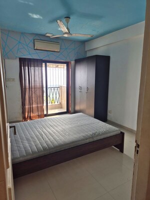 Bedroom in 3 BHK Apartment at NRI Complex Phase I, Seawoods Sector 58 – for Rent