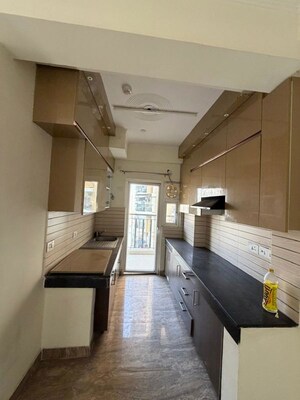 Kitchen in 2 BHK Apartment at Mahagun Mywoods, Sector 16c Greater Noida – for Rent