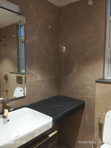 Bathroom in 3 BHK Apartment at Smart World Orchard, Sector 61 – for Rent