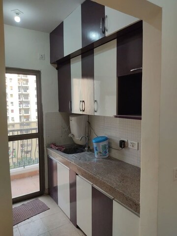 Kitchen in 2 BHK Apartment at Amrapali Golf Homes, Sector 4 Greater Noida – for Sale
