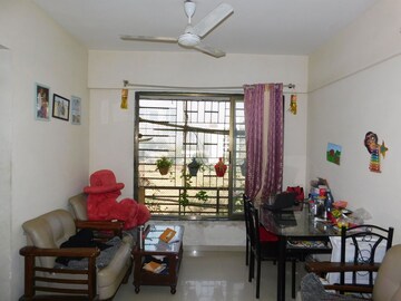 Living Room in 1 BHK Apartment at Metropolis Bayside, Kasarvadavali – for Rent