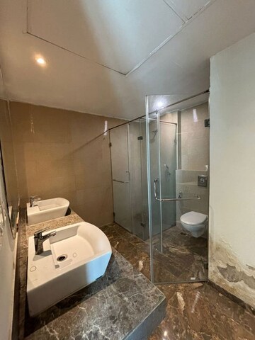 Bathroom in 4 BHK Apartment at Mahagun Mezzaria, Sector 78 – for Sale