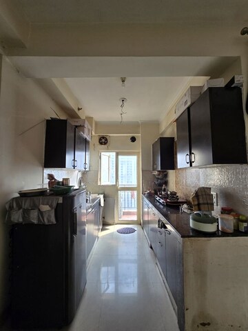 Kitchen in 2 BHK Apartment at Aims Golf City, Sector 75 – for Rent