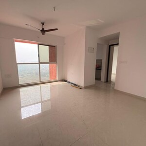 Living Room in 1 BHK Apartment at Lodha Codename Premier, Mangaon – for Sale
