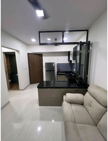 Living Room in 1 BHK Apartment at Lodha Crown Quality Homes, Majiwada – for Rent