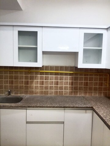 Kitchen in 2.5 BHK Apartment at Mahagun Mywoods II, Sector 16c Greater Noida – for Rent