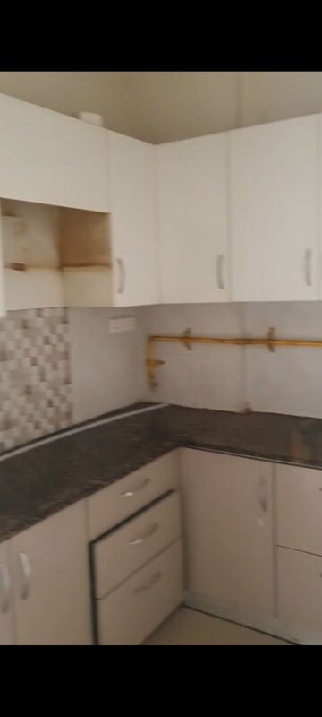Kitchen in 3 BHK Apartment at AFOWO Raksha Addela, Sector 16c Greater Noida – for Rent