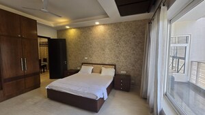 Bedroom in 4 BHK Builder Floor at Sushant Lok I – for Rent
