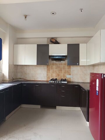 Kitchen in 4 BHK Apartment at Amrapali Heartbeat City, Sector 107 – for Rent