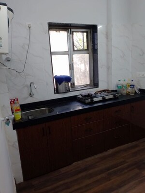 Kitchen in 2 BHK Apartment at Shubh Tirupati Apartment, Andheri West – for Rent