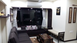 Living Room in 2 BHK Apartment at Dheeraj Heritage Residency, Santacruz West – for Sale