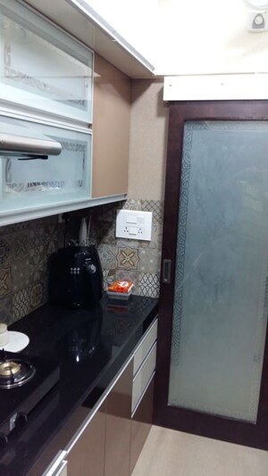 Kitchen in 2 BHK Apartment at Dheeraj Heritage Residency, Santacruz West – for Sale