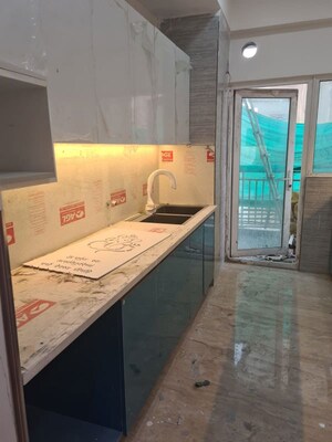 Kitchen in 4 BHK Apartment at Mahagun Moderne, Sector 78 – for Rent