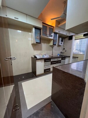 Kitchen in 3 BHK Apartment at Dynamix Shagun Mall Tower, Malad East – for Rent