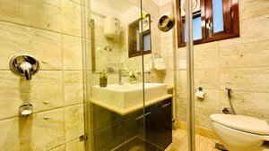 Bathroom in 4 BHK Builder Floor at Green Park – for Rent