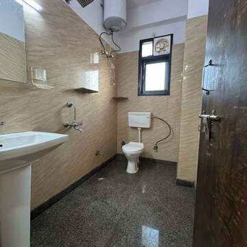 Bathroom in 2 BHK Apartment at Palm Residency Chhatarpur, Rajpur Khurd Extension – for Rent