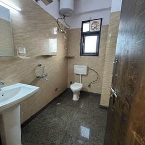 Bathroom in 2 BHK Apartment at Palm Residency Chhatarpur, Rajpur Khurd Extension – for Rent