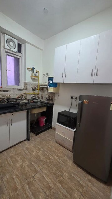 Kitchen in 1 RK Apartment at Urbtech Xaviers, Sector 168 – for Rent