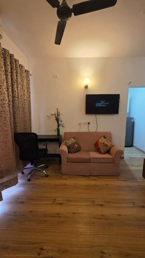 Living Room in 1 RK Apartment at Urbtech Xaviers, Sector 168 – for Rent