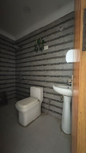 Bathroom in 2 BHK Apartment at Palm Residency Chhatarpur, Rajpur Khurd Extension – for Rent