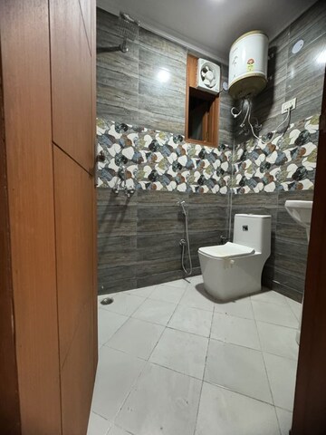 Bathroom in 2 BHK Builder Floor at Palm Residency Chhatarpur, Rajpur Khurd Extension – for Rent