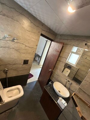 Bathroom in 4 BHK Apartment at Mahagun Moderne, Sector 78 – for Sale