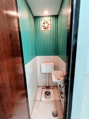 Bathroom in 4 BHK Apartment at Mahavir Enclave 1 – for Sale