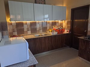 Kitchen in 2 BHK Apartment at Gaur Atulyam, Omicron I Greater Noida – for Rent
