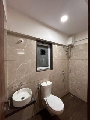 Bathroom in 1 BHK Apartment at Ashapura The Rising 58, Tagore Nagar – for Rent