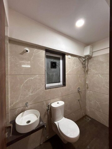 Bathroom in 1 BHK Apartment at Ashapura The Rising 58, Tagore Nagar – for Rent