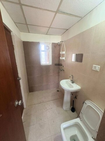 Bathroom in 3 BHK Apartment at Amrapali Heartbeat City, Sector 107 – for Rent