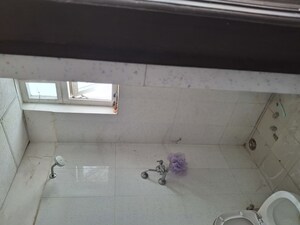 Bathroom in 2.5 BHK Apartment at Urban Axis Urban Woods, Sushant Golf City – for Rent