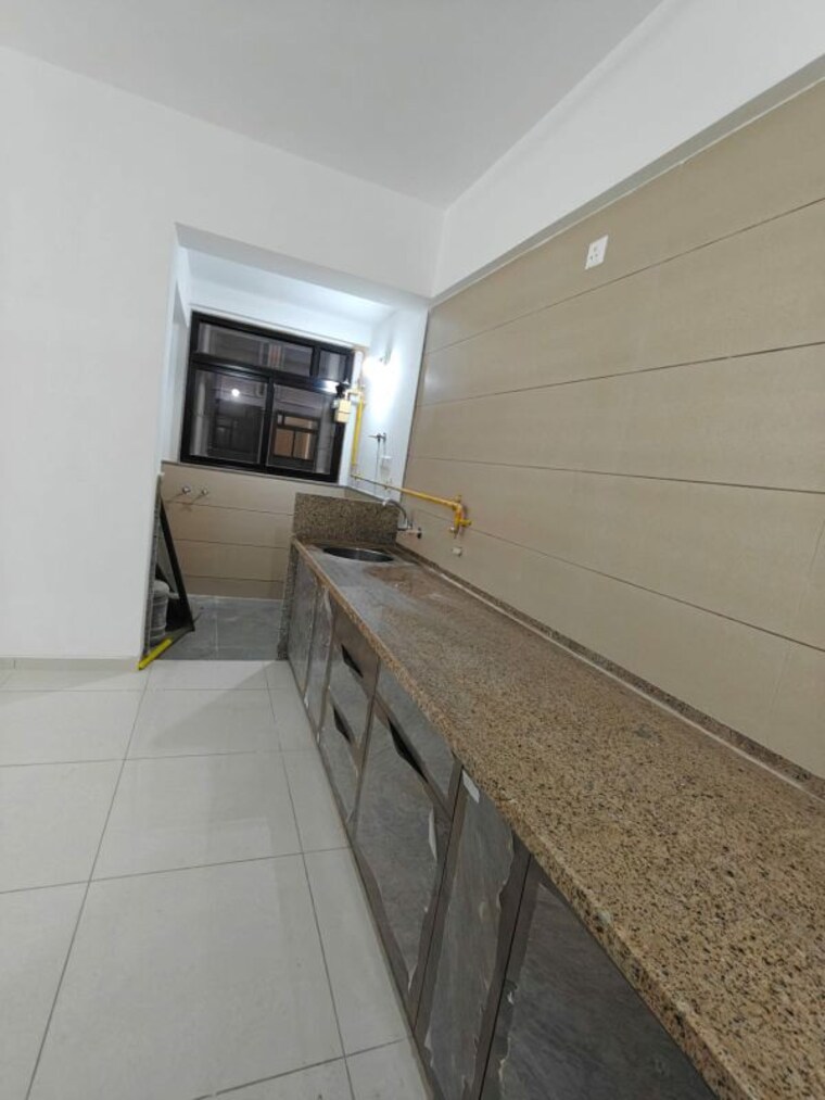 Kitchen, sun-atmosphere 3 Bedroom 1700 Sq.Ft. Apartment In Shela Ahmedabad 9949142