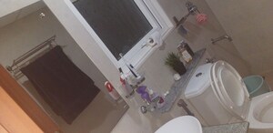 Bathroom in 2 BHK Apartment at Bhartiya City Nikoo Homes II, Thanisandra Main Road – for Rent