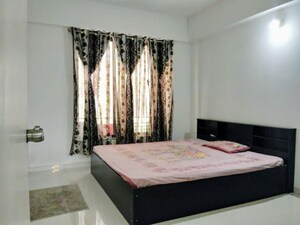 Bedroom in 2 BHK Apartment at Near Vaishno Devi Circle On Sg Highway – for Rent